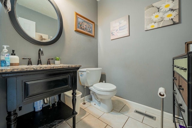 bathroom with tile patterned flooring, visible vents, baseboards, toilet, and vanity