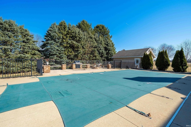 pool featuring a patio area and fence