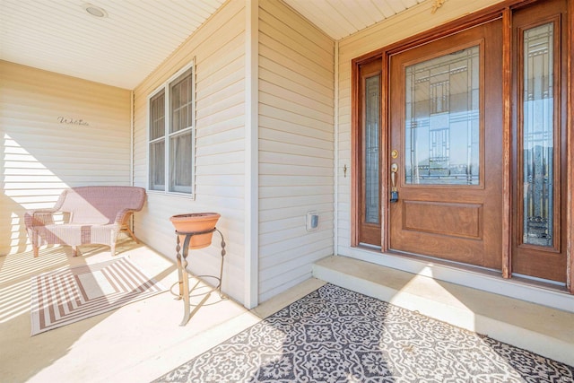 doorway to property featuring covered porch