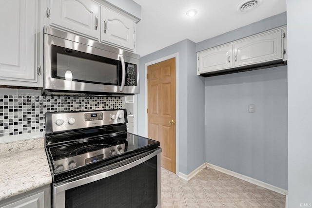 kitchen with white cabinetry, light countertops, visible vents, and appliances with stainless steel finishes