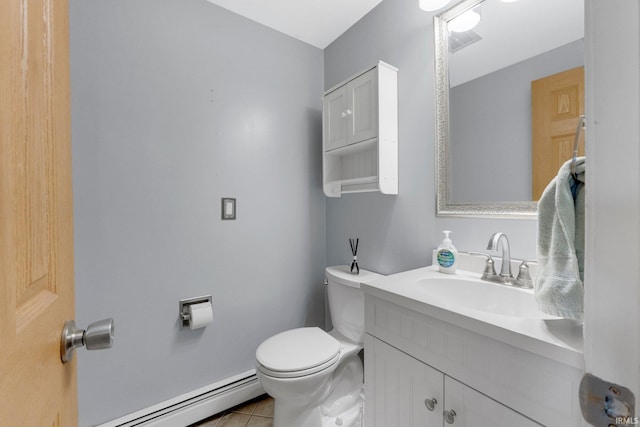 half bathroom featuring toilet, baseboard heating, vanity, and tile patterned flooring