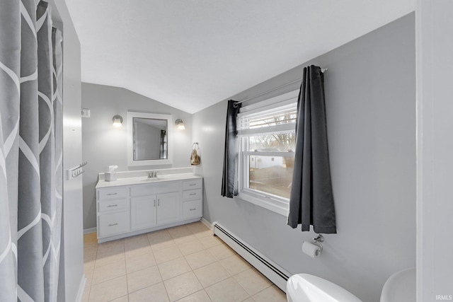 half bath with toilet, vaulted ceiling, tile patterned floors, vanity, and a baseboard radiator