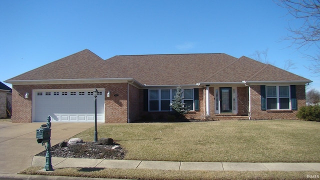 ranch-style home with brick siding, driveway, an attached garage, and a front lawn