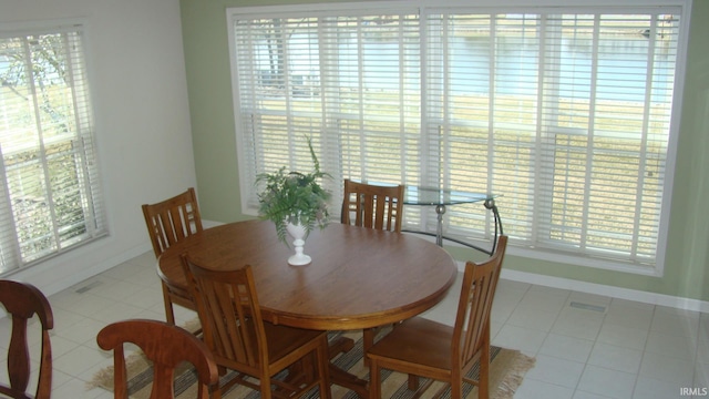 dining space featuring baseboards and a wealth of natural light