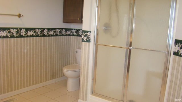 full bath featuring tile patterned floors, visible vents, a shower stall, and toilet