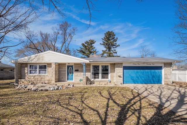 view of front of house featuring a front yard, fence, an attached garage, concrete driveway, and stone siding