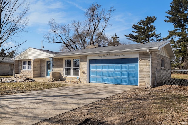 single story home with fence, concrete driveway, a chimney, stone siding, and an attached garage