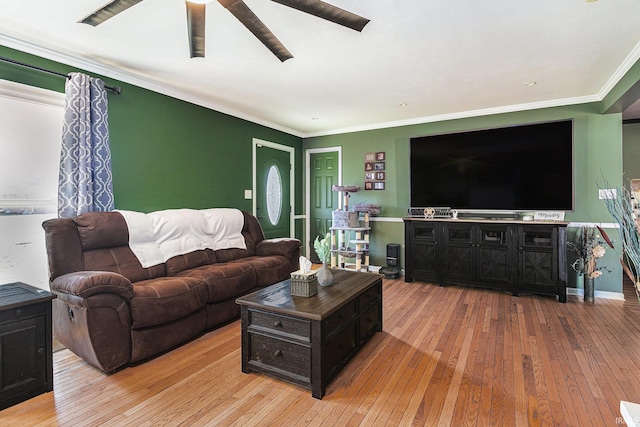 living room featuring ornamental molding, a ceiling fan, and hardwood / wood-style floors