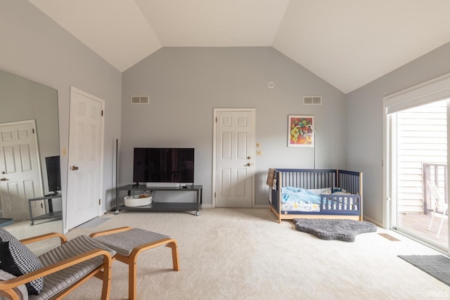 bedroom with visible vents, high vaulted ceiling, and carpet