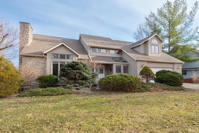 view of front of home featuring stone siding, a front lawn, and a shingled roof