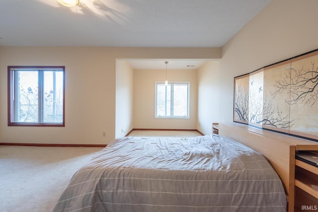 bedroom with carpet flooring and baseboards