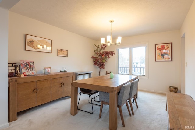 dining room featuring baseboards, light colored carpet, and an inviting chandelier