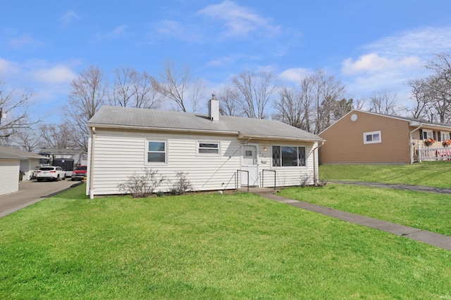 view of front of property featuring a front yard and a chimney