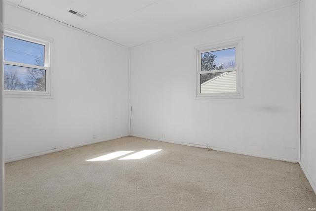 carpeted spare room with visible vents