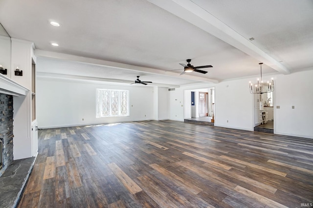 unfurnished living room featuring dark wood-type flooring, baseboards, beam ceiling, ceiling fan with notable chandelier, and a fireplace