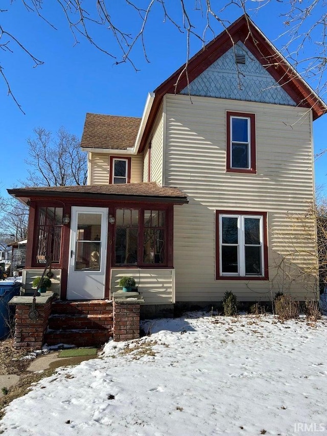 view of front of property with a sunroom