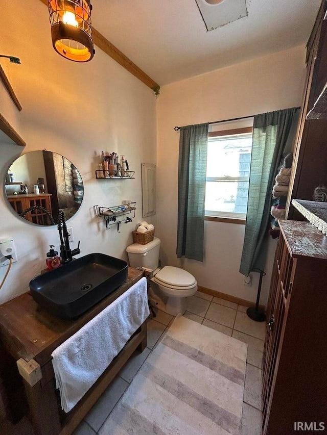 bathroom with vanity, tile patterned floors, and toilet