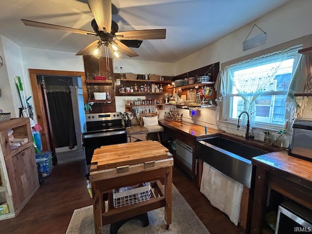 kitchen with ceiling fan, dark wood finished floors, butcher block countertops, electric range, and open shelves