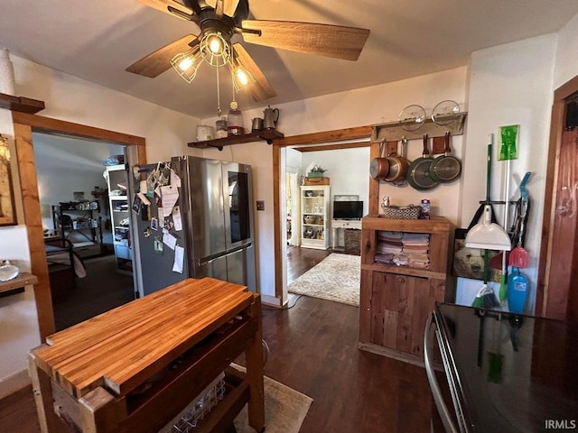 dining room with dark wood-type flooring and ceiling fan