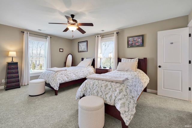 bedroom with a ceiling fan, carpet, visible vents, and baseboards