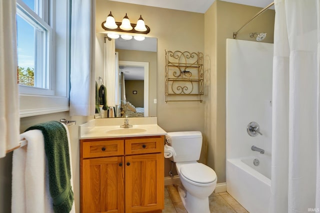 bathroom featuring toilet, shower / tub combo with curtain, ensuite bath, tile patterned floors, and vanity