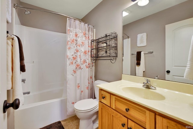 bathroom with tile patterned flooring, toilet, vanity, and shower / bath combo