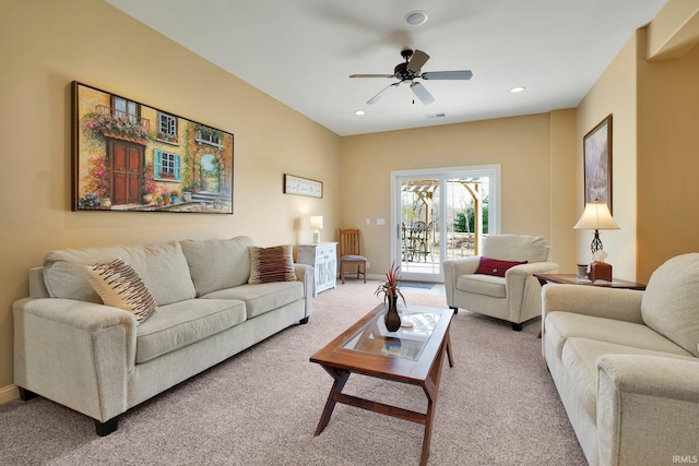 living area with recessed lighting, a ceiling fan, baseboards, and light carpet