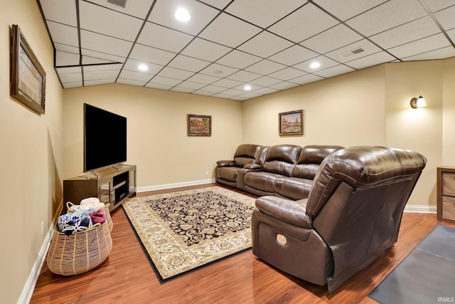 living area featuring wood finished floors, visible vents, and baseboards