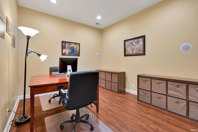 home office with visible vents, recessed lighting, wood finished floors, and baseboards