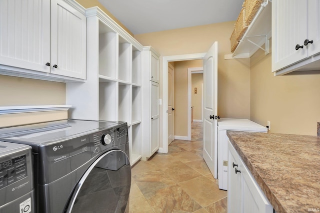 laundry area with cabinet space and washing machine and dryer