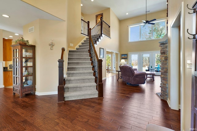 foyer entrance featuring visible vents, baseboards, stairs, recessed lighting, and dark wood-style floors