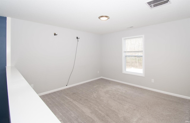 803 Knights Xing, Kendallville, IN 46755 - spare room featuring visible vents, baseboards, and carpet flooring