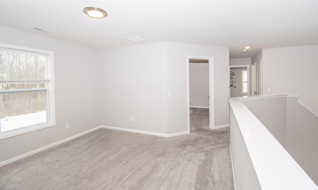803 Knights Xing, Kendallville, IN 46755 - spare room featuring visible vents, light colored carpet, and baseboards