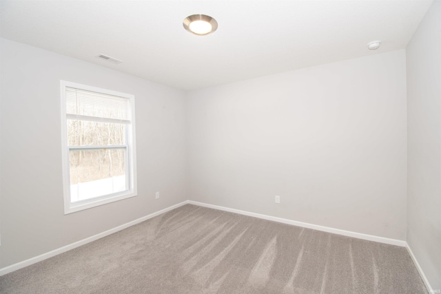 803 Knights Xing, Kendallville, IN 46755 - spare room with visible vents, baseboards, and carpet