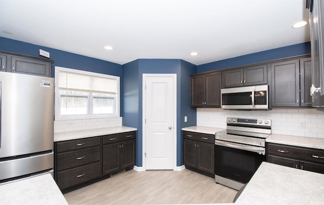 803 Knights Xing, Kendallville, IN 46755 - kitchen with light countertops, light wood-style floors, and appliances with stainless steel finishes