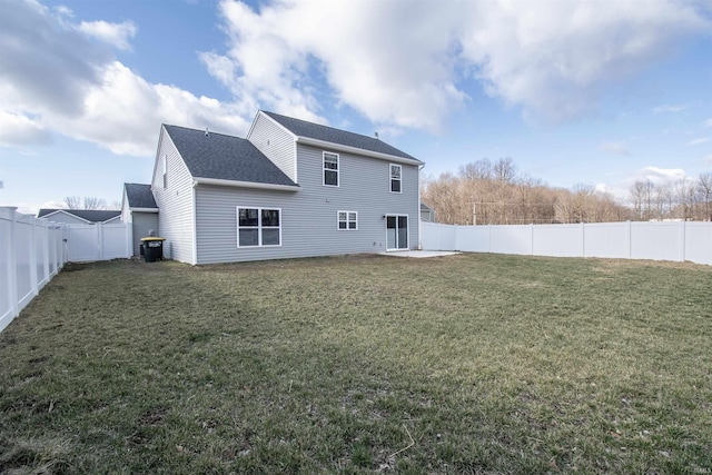 803 Knights Xing, Kendallville, IN 46755 - rear view of property featuring a lawn, a shingled roof, and a fenced backyard