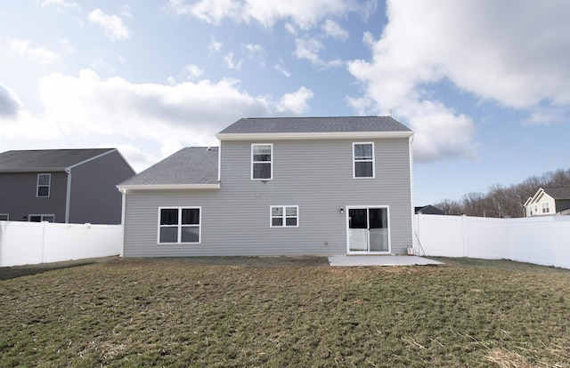803 Knights Xing, Kendallville, IN 46755 - back of property with a lawn, roof with shingles, a fenced backyard, and a patio area