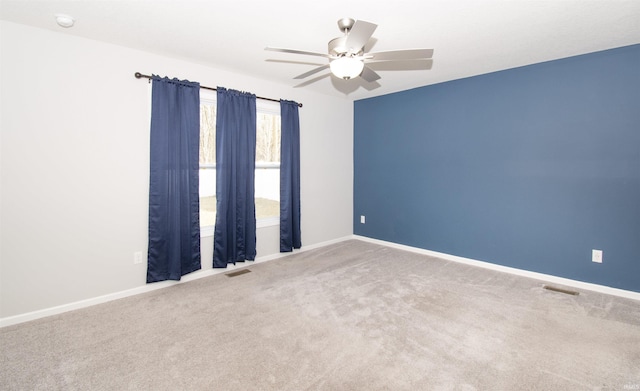803 Knights Xing, Kendallville, IN 46755 - spare room with visible vents, baseboards, carpet, and ceiling fan