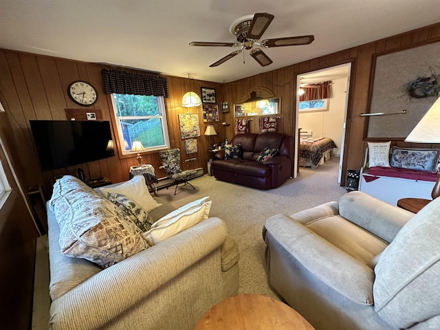 carpeted living room featuring ceiling fan