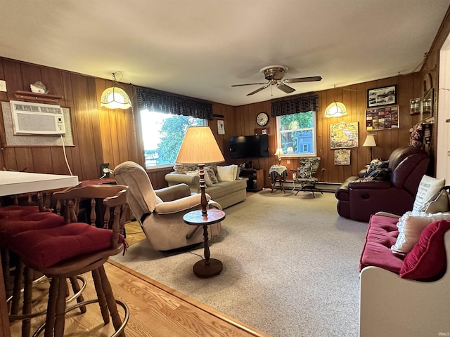 living room with wooden walls, carpet flooring, a ceiling fan, and a wall mounted AC