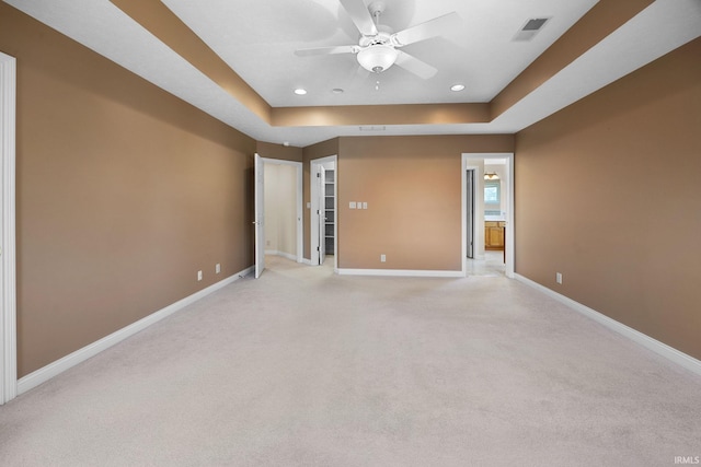 unfurnished room featuring a ceiling fan, baseboards, visible vents, and light colored carpet