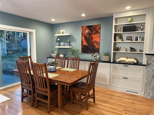 dining room with recessed lighting, visible vents, and light wood finished floors