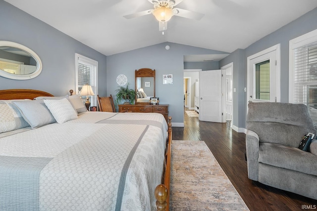 bedroom featuring dark wood finished floors, vaulted ceiling, baseboards, and ceiling fan