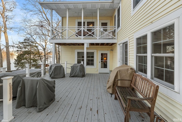 wooden terrace featuring a grill