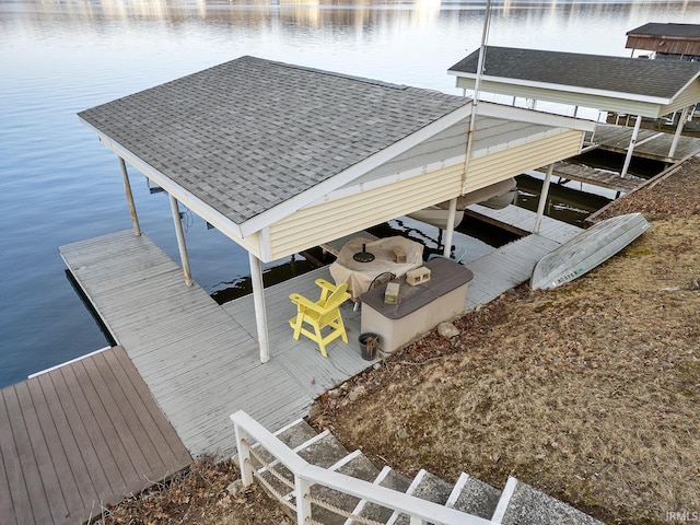 view of dock featuring a water view and boat lift