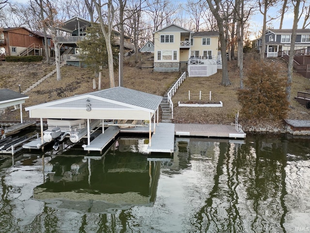 dock area featuring stairway, a water view, a residential view, and boat lift