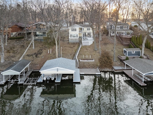 birds eye view of property featuring a residential view and a water view