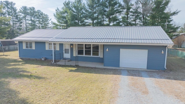 single story home with a porch, gravel driveway, a front yard, and fence