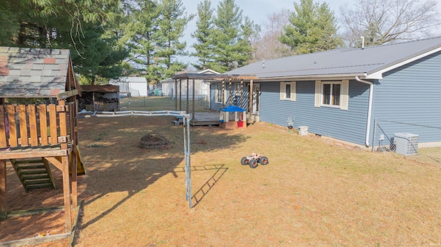 view of yard featuring fence and a pergola