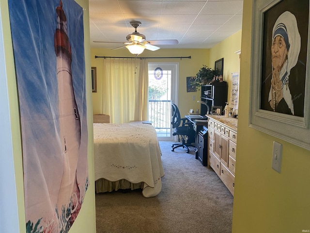 bedroom featuring access to exterior, a ceiling fan, and carpet floors